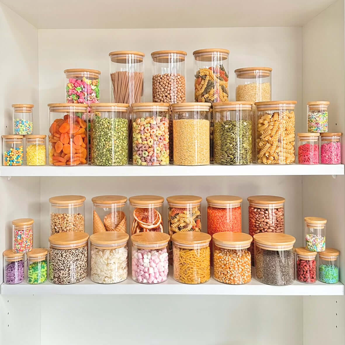 Round glass storage jars with bamboo lids for pantry organization and space-saving