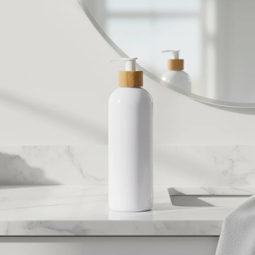 White bottle with a wooden pump on a white background