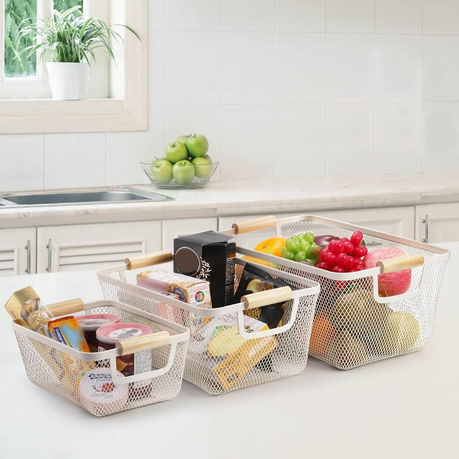 White mesh basket with wooden handles used for kitchen storage and organization.
