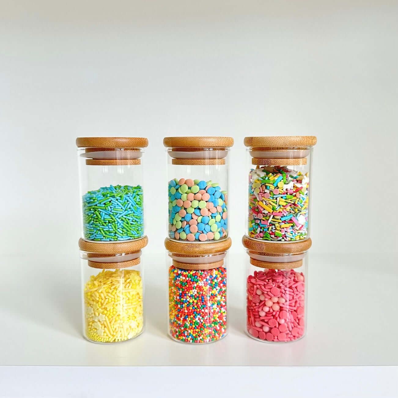 Bamboo glass jars with colorful pantry storage, ideal for space-saving kitchen organization.